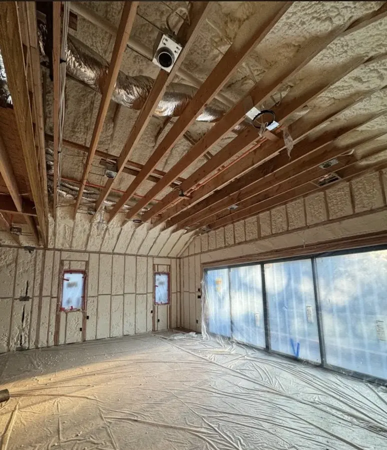 Interior walls and ceiling insulated with spray foam during new construction in West Manchester